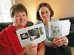 Photo: Linda Holmquist Darrach, left, and her daughter, Crystal Alexander, both of Folsom, hold photos of Darrach's father, Sgt. Harold D. Holmquist, and a ring he was wearing when he was shot down in Italy in World War II.